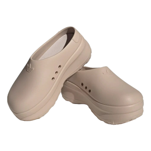 Beige slip-on clogs featuring the Adidas logo and ventilation holes on the sides, designed with a chunky sole.
