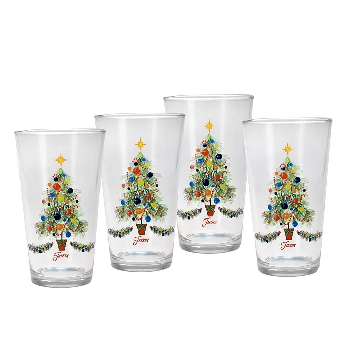Four clear glass tumblers with a decorated Christmas tree design and a star on top, each glass features the Fiesta logo near the base.