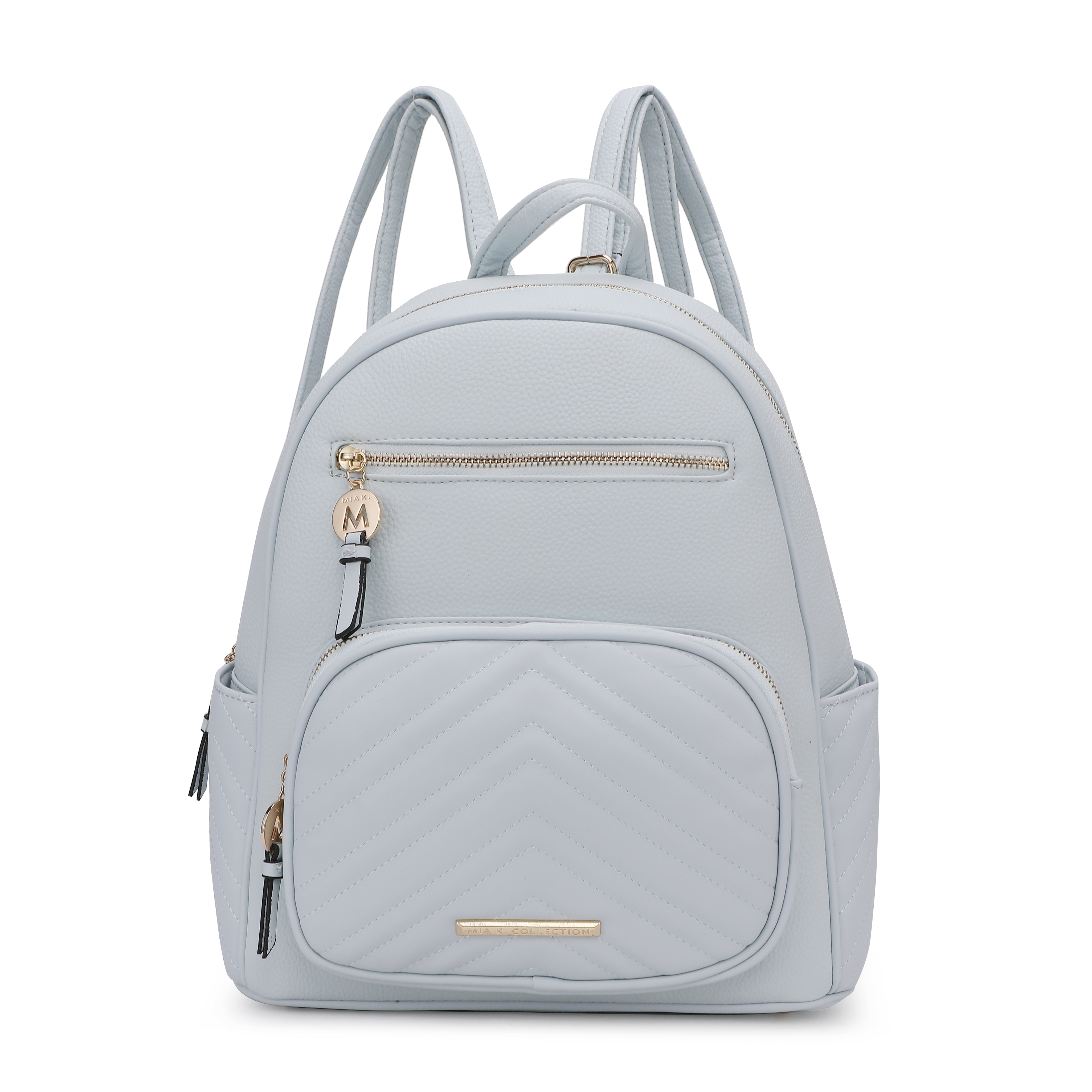 Light blue backpack with quilted front pocket, gold zipper accents, and an \“M\“ charm. Features adjustable shoulder straps and multiple compartments for storage.