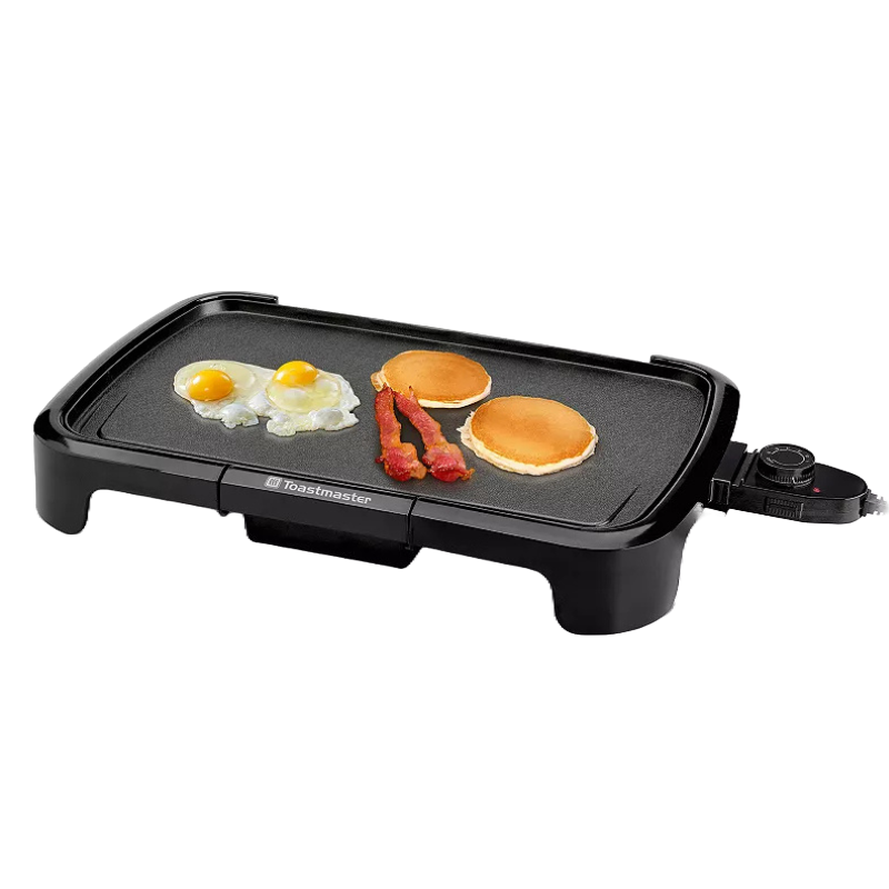 Electric griddle with a non-stick surface featuring eggs, bacon, and pancakes, equipped with an adjustable temperature control knob.