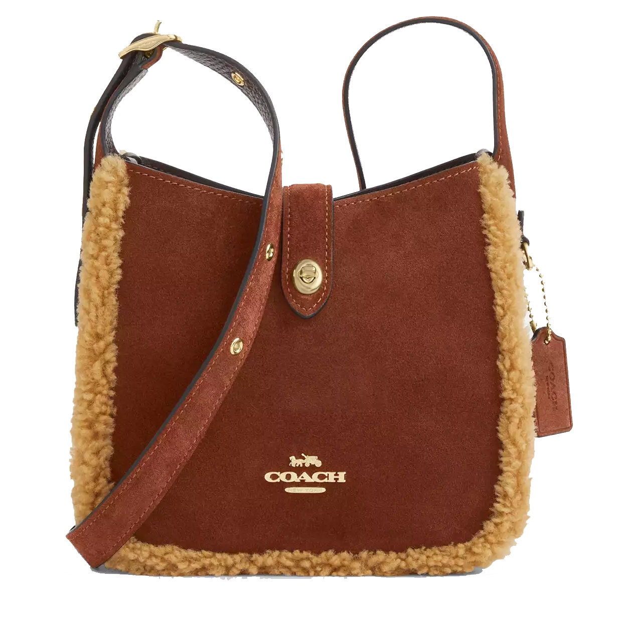 Coach shoulder bag with brown suede, gold logo, and shearling trim. Features adjustable strap and flap closure with gold snap button.