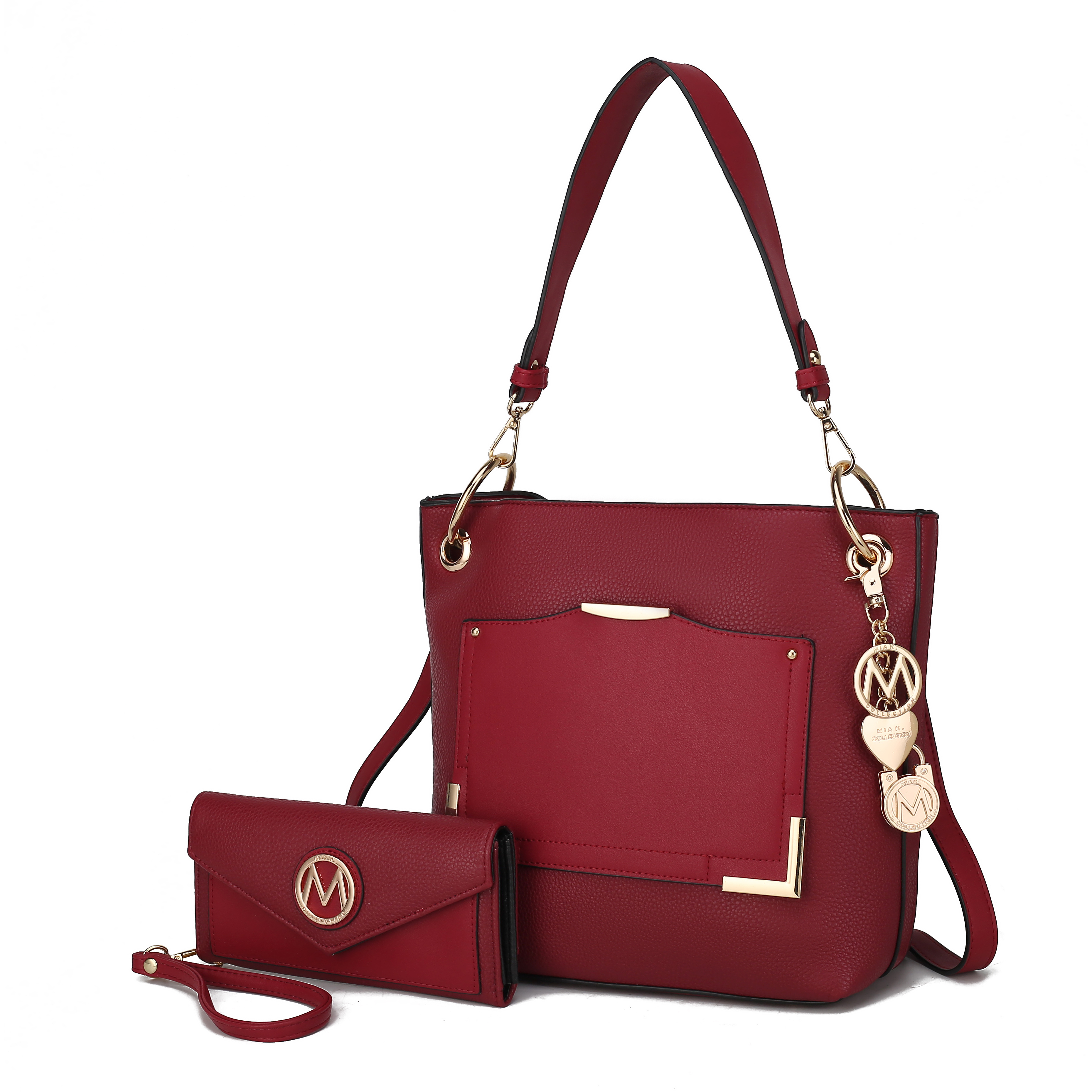 A red shoulder bag with gold-tone accents and a matching red wristlet, both featuring a circular logo detail.