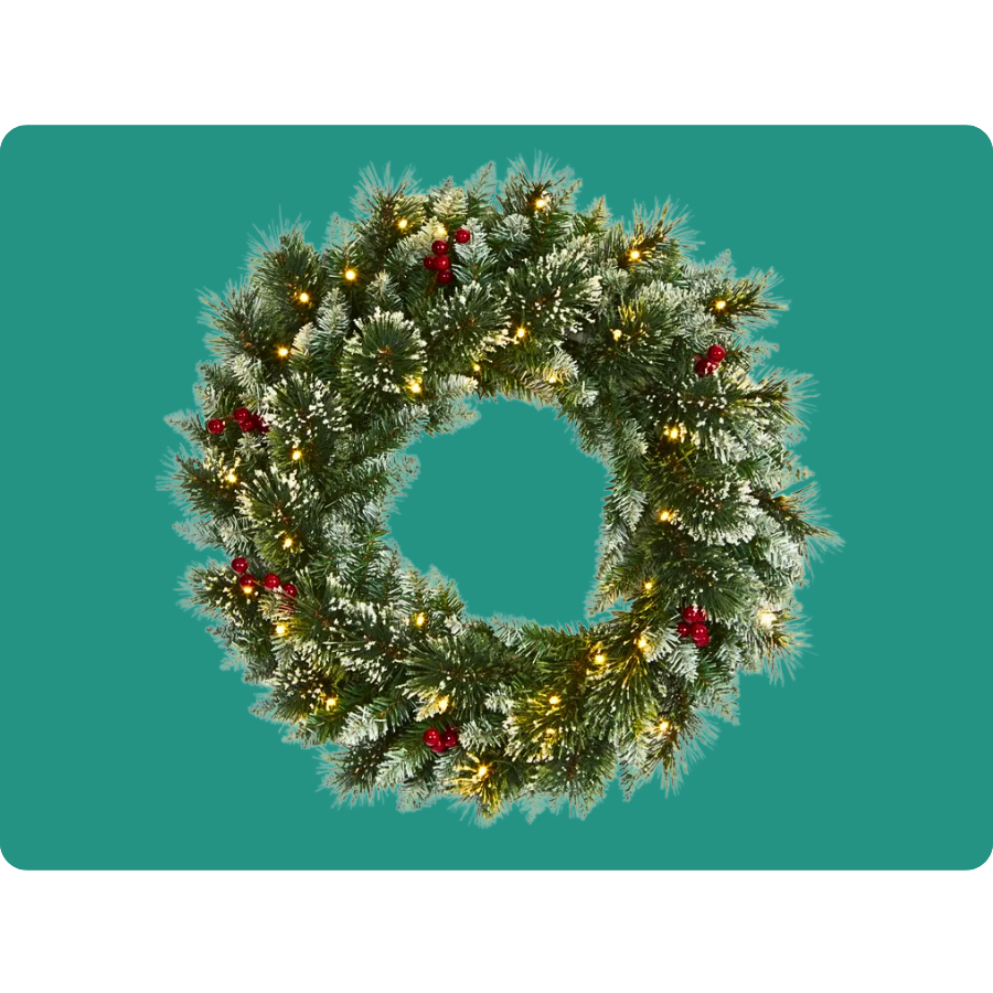 A Christmas wreath decorated with frosted pine needles, red berries, and warm white lights.