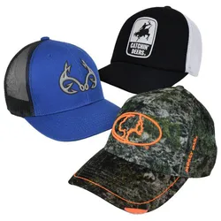 Three baseball caps are displayed: a blue cap with an antler logo, a black and white mesh cap with \“Catchin' Deers\“ text and graphic, and a camo cap with an orange logo and the \“Mossy Oak\“ branding.