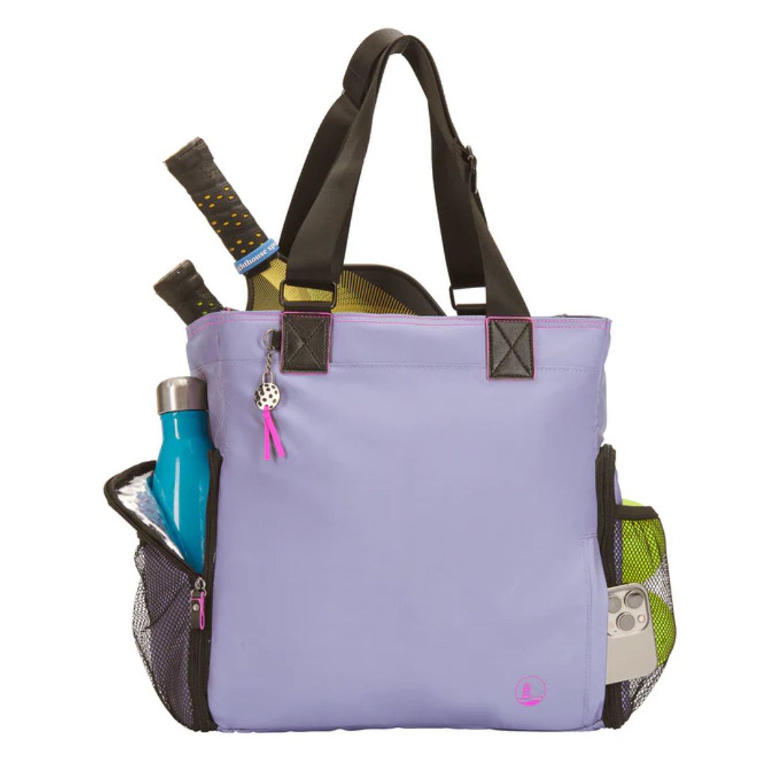 A lilac tennis tote bag with black handles features mesh side pockets holding a water bottle and tennis balls, plus two rackets in the main compartment.