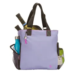 A lilac tennis tote bag with black handles features mesh side pockets holding a water bottle and tennis balls, plus two rackets in the main compartment.