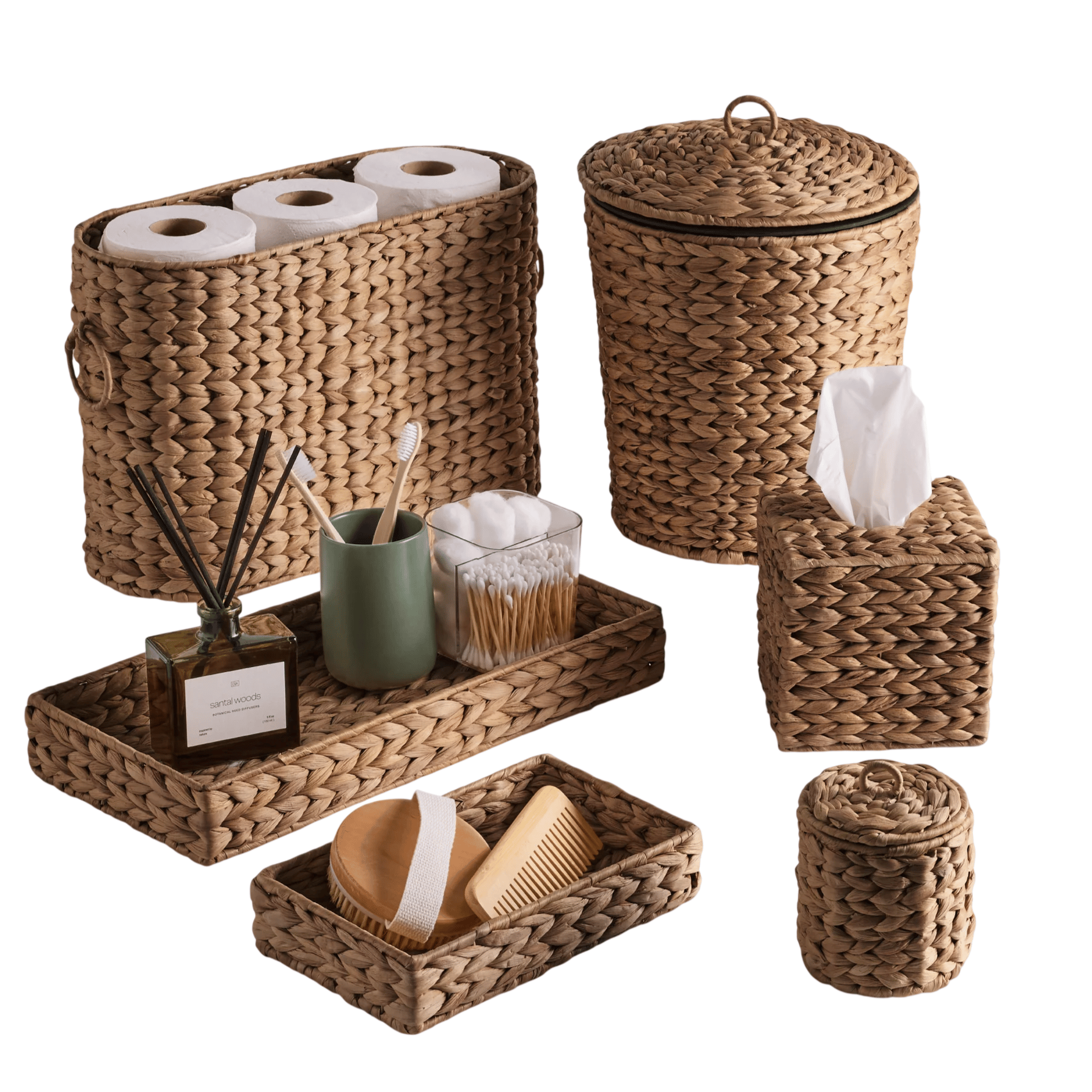 Set of woven baskets and trays, including a toilet paper holder, waste bin, tissue box, and small trays with personal care items like toothbrushes and a comb.