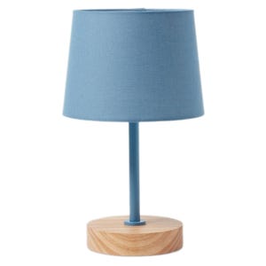 A table lamp with a blue fabric shade and cylindrical wooden base.