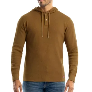 Brown long-sleeve waffle knit hoodie with a drawstring and buttoned neckline, worn with blue jeans.