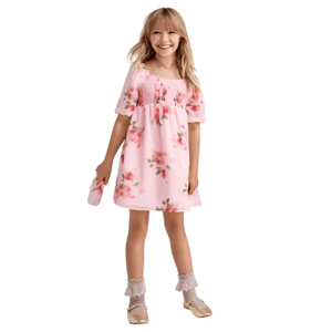 Girl wearing a pink floral dress with puff sleeves, paired with lace-trimmed socks and gold shoes. She holds a matching floral purse.