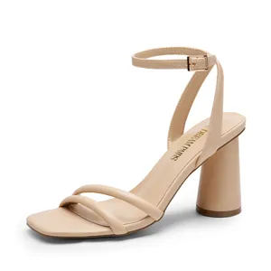 A beige sandal with a block heel and ankle strap featuring two thin straps across the toe.