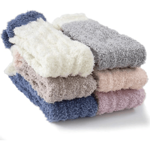A stack of fluffy, textured socks in various colors, including cream, grey, beige, pink, and blue.
