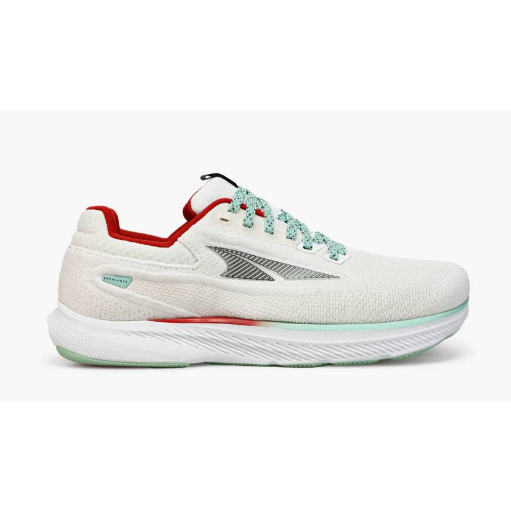 A single white running sneaker with green laces, red accents, and a striped side pattern.