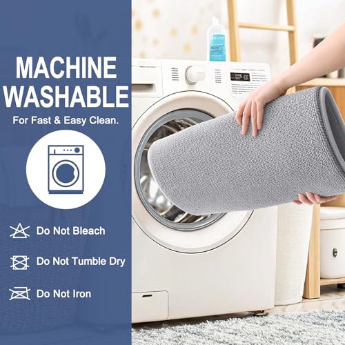 Machine-washable gray rug being placed in a washing machine; instructions indicate not to bleach, tumble dry, or iron.