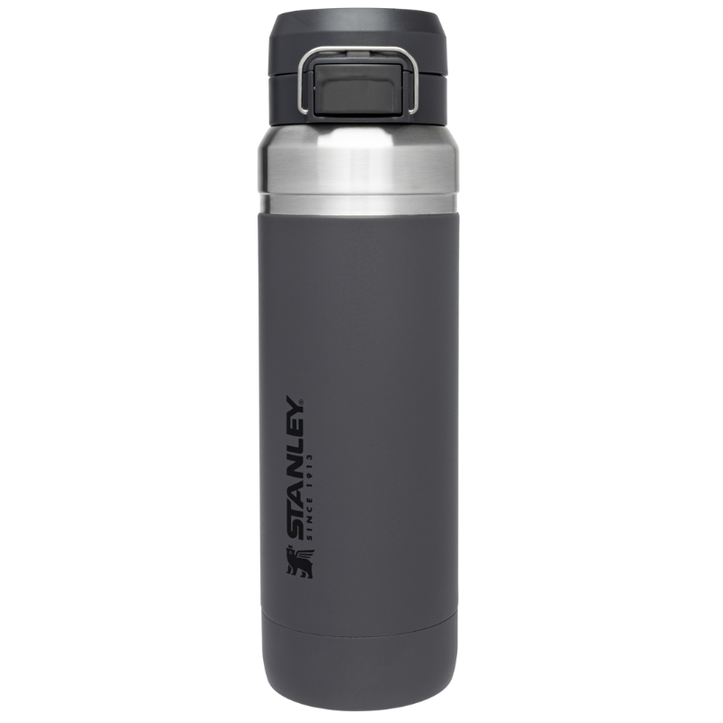 A gray Stanley travel mug featuring a secure flip-top lid and sleek stainless steel accents.