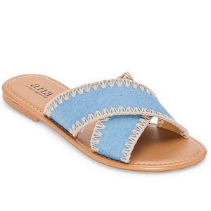 A.n.a Cross Slide Sandals feature light blue denim straps with beige stitching, an open toe design, and a flat tan sole, providing a casual and stylish look.
