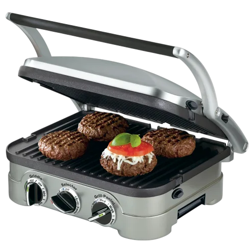 A countertop grill with adjustable settings is cooking four burger patties, one topped with cheese, tomato, and basil.