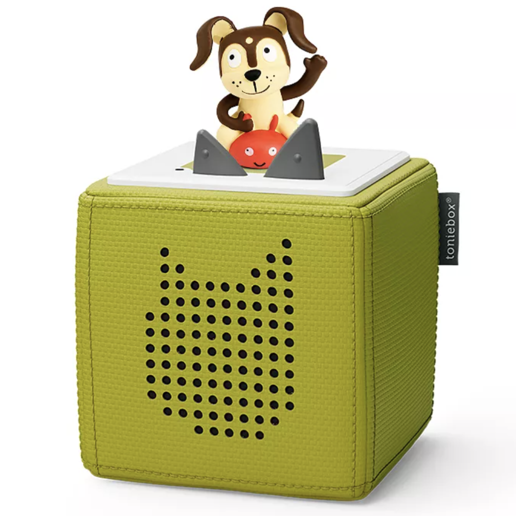 A green Toniebox audio player featuring a whimsical dog figure on top. The device is designed for children to play audio stories and songs.
