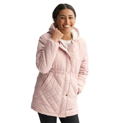A woman is wearing a light pink, quilted hooded jacket, featuring a button and zip closure with side pockets.