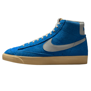 Blue high-top sneaker with a textured suede finish, beige sole, white laces, and a gray swoosh logo.