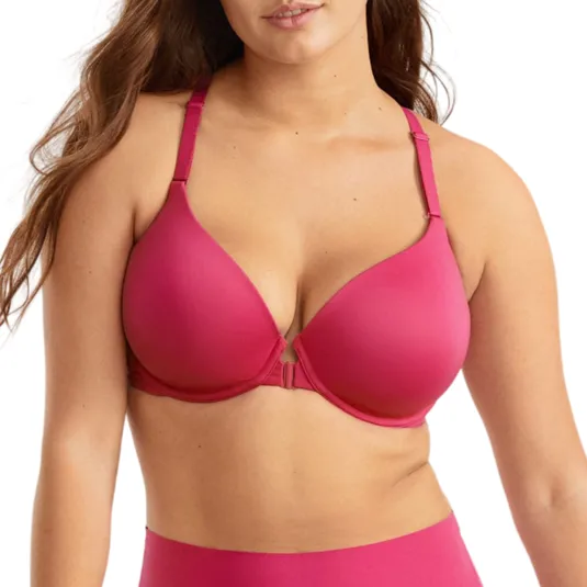 A woman wearing a pink bra and high-waisted panties, styled for a lingerie photoshoot.