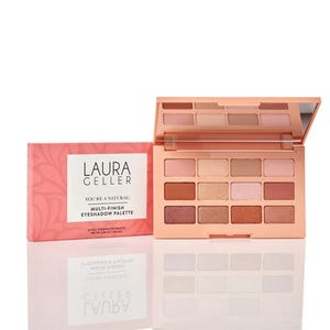 Laura Geller's \“You're a Natural\“ multi-finish eyeshadow palette features 12 neutral shades in matte and shimmer finishes, housed in a sleek, pink case with a mirror.