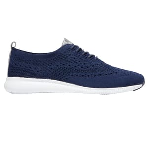 A navy blue knit sneaker with a perforated design, featuring a white sole for contrast. Ideal for casual wear.
