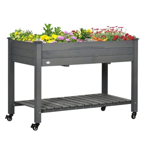 A gray elevated garden bed on wheels with colorful flowers, featuring a lower slatted shelf for additional storage.