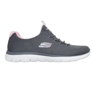 A gray athletic shoe with a white sole and pink accents, featuring a logo on the side.