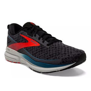 A Brooks running shoe featuring a black textured upper with red accents and a cushioned sole designed for comfort and support.