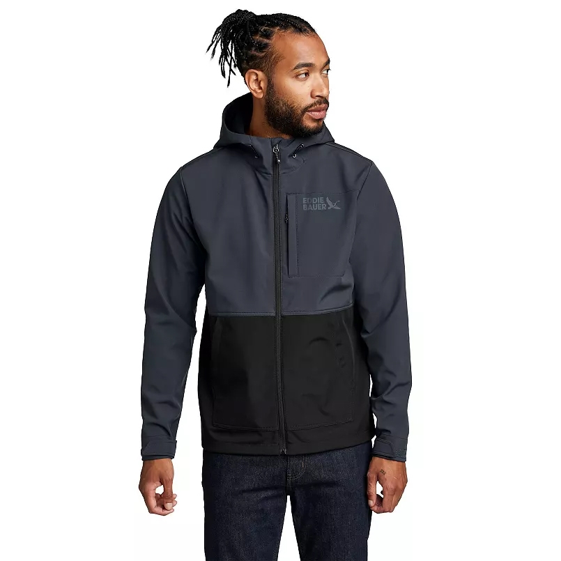 A man wears a two-tone hooded jacket by Eddie Bauer, featuring a full zipper and chest pocket.
