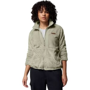 A woman wearing a light green fleece jacket with a zip-up front and two pockets, paired with dark pants.