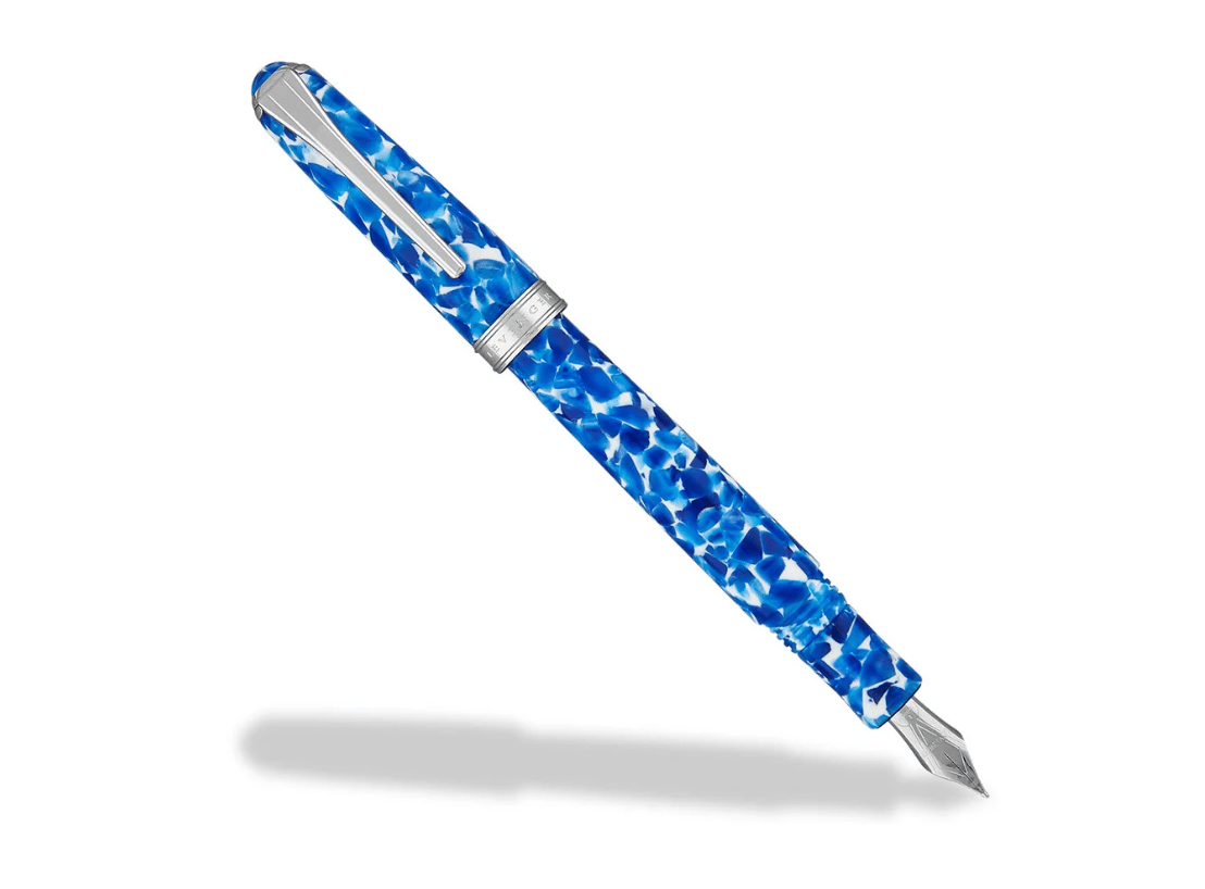 A blue marbled fountain pen with a silver clip and band, featuring a sleek and artistic design.