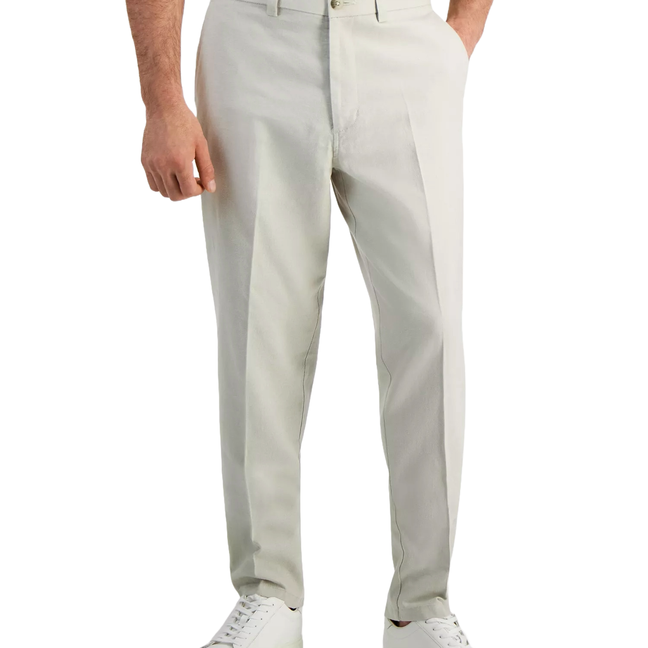 A pair of light beige tailored trousers with a button closure, paired with white sneakers. The outfit features a simple, classic style suitable for casual wear.