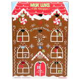 Muk Luks Gift Shoppe features a \“12 Days of Socks\“ advent calendar with numbered doors, designed like a gingerbread house. Suitable for women's shoe sizes 6-11.