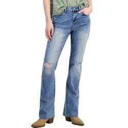 Blue distressed bootcut jeans paired with light brown ankle boots.