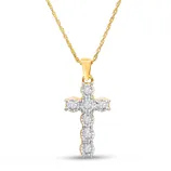 A gold chain with a pendant shaped in the form of a cross, adorned with diamonds for a sparkling effect.