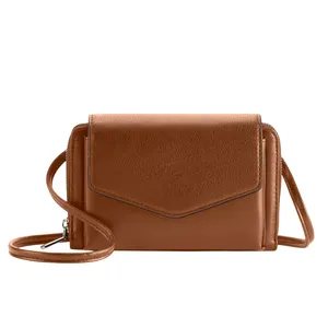 A brown leather crossbody bag with a flap closure and adjustable strap, featuring a compact, rectangular design.