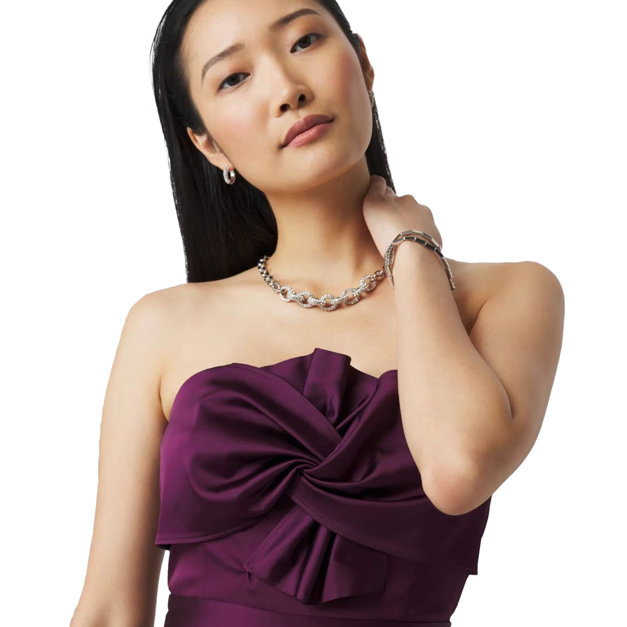 The WHBM Strapless Twist Jumpsuit features a deep purple hue with a stylish twist design on the bodice. It's complemented by elegant jewelry, including a necklace and matching bracelet.