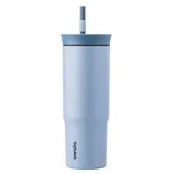 A light blue Owala tumbler with a straw, featuring a sleek design and the brand name printed vertically on the side.