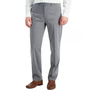 Gray dress pants paired with brown loafers.