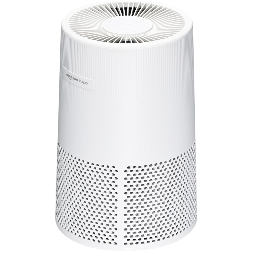 Amazon Basics air purifier in a white cylindrical design with a vented top and perforated sides.
