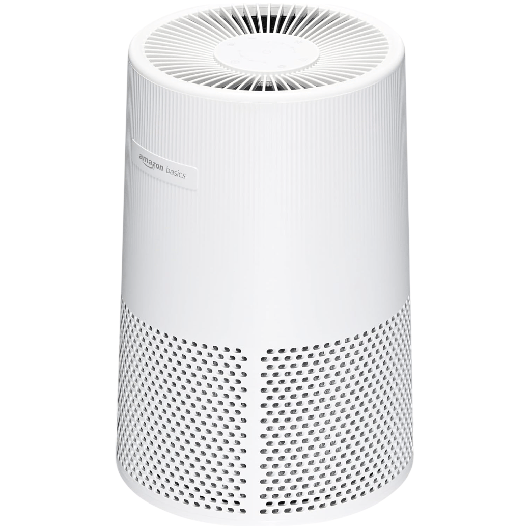 Amazon Basics air purifier in a white cylindrical design with a vented top and perforated sides.