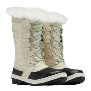 Tan and black winter boots with white faux fur lining and light blue laces, featuring a quilted design and sturdy soles for cold weather.