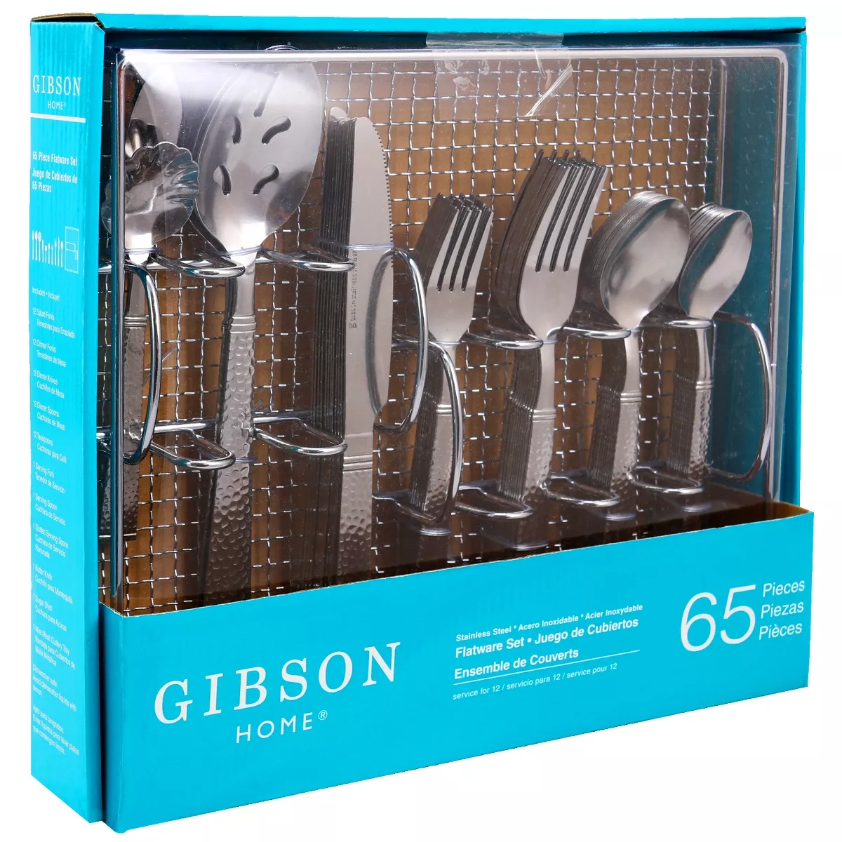 Gibson Home 65-piece flatware set includes stainless steel forks, knives, spoons, and serving utensils designed for 12 place settings. The set is packaged in a blue box with individual compartments for each item.