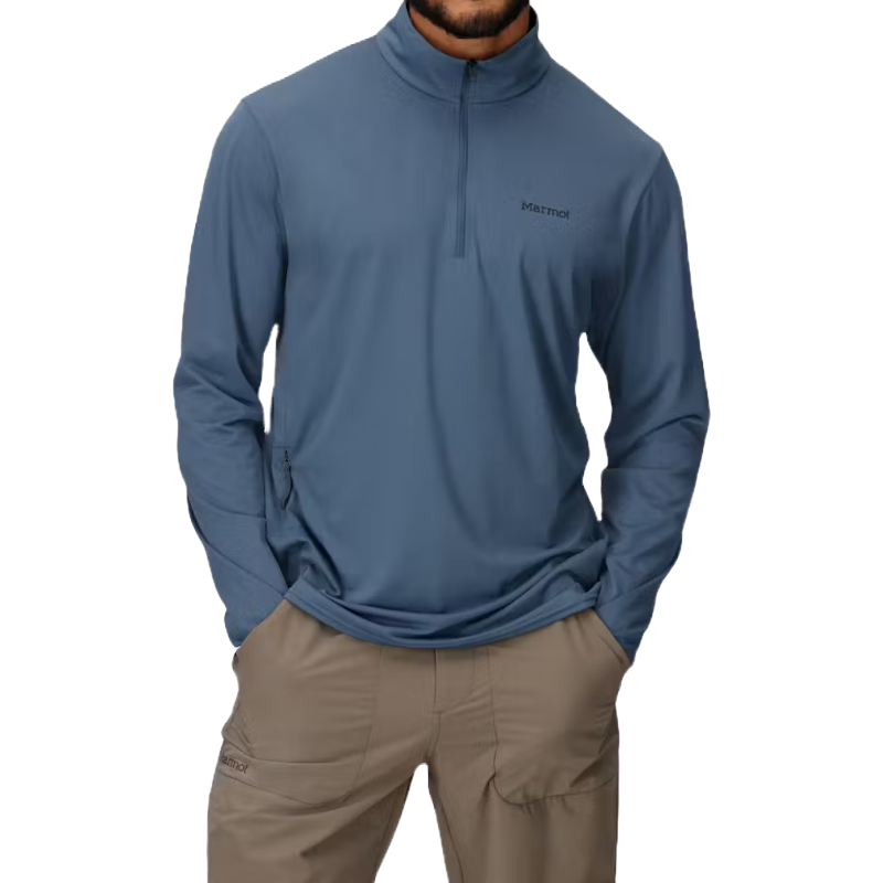 A person is wearing a blue Marmot quarter-zip pullover with long sleeves, paired with beige cargo-style pants.
