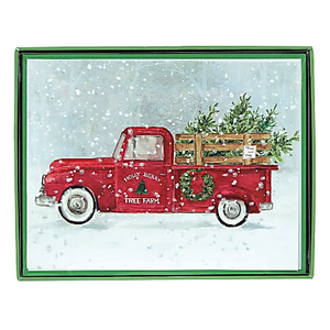 A holiday-themed card depicting a vintage red truck carrying Christmas trees in a snowy setting, with \“Holly Berry Tree Farm\“ written on the side.