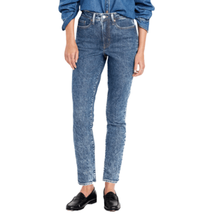 High-waisted, ankle-length skinny jeans with a medium wash and subtle distressed texture. Paired with black loafers and a matching denim shirt.