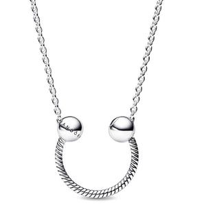 A silver necklace featuring a twisted U-shaped pendant with two smooth round beads on each end, one engraved with \“PANDORA,\“ attached to a chain.