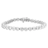 A tennis bracelet featuring round, bezel-set diamonds secured in a white metal setting with a box clasp closure.